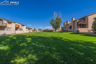Front view of yard with a balcony