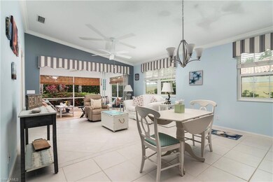 Dining space with ornamental molding, light tile p
