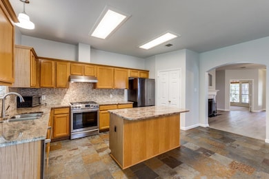 Kitchen featuring appliances with stainless steel