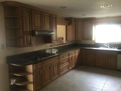 KITCHEN WITH PASS THRU WINDOW TO FAMILY ROOM