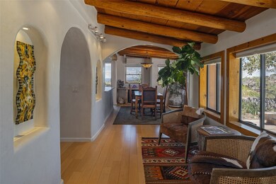 Entry Sitting Room windows open to spacious flagstone terrace