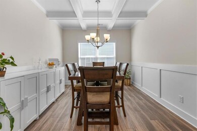 Formal Dining Room with coffered ceilings and chai