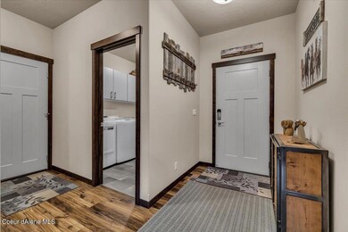 Entry, Laundry Room and Entry to Garage