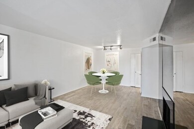 Recessed lighting throughout. Living opens to dini
