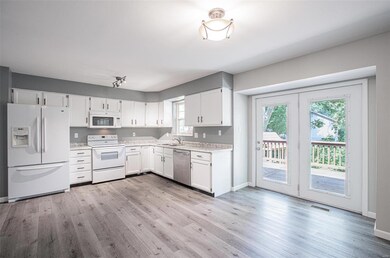 Charming kitchen with lots of natural lighting and