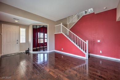 Front Foyer with hardwood floors leading to the fa