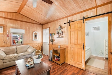 Living room featuring a wall mounted air condition