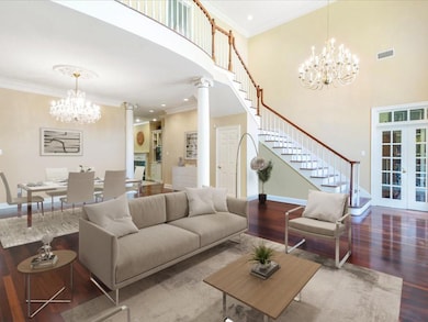 19 ft. ceiling in entrance w/ fabulous curved staircase and tons of natural light. Virtually Staged