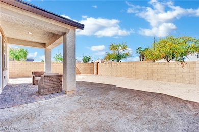 Fenced backyard featuring a patio