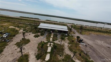Aerial overview of property's location featuring a large body of water