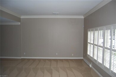 Open Living Area features Wall of Custom Shuttered Windows