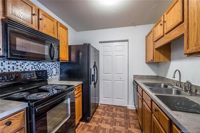 Galley-style kitchen leads to a dedicated laundry 