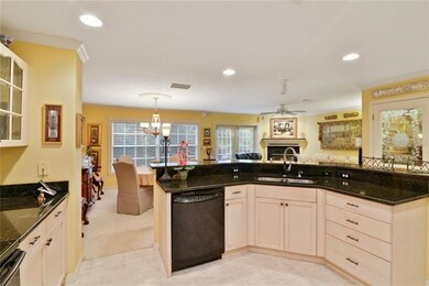 Open kitchen overlooks living/dining space and win