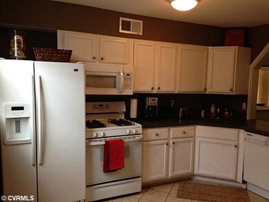 Kitchen - The tiled Kitchen has great light and am