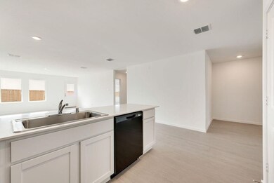 Kitchen with dishwasher, recessed lighting, light wood-style floors, light countertops, and white cabinets