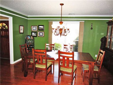 This impressive formal dining room features hardwo