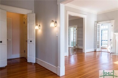 Broad welcoming walkway with dual urns, original f