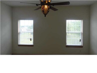 The master bedroom has twin windows which let in t