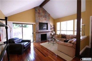 Another view of living room with custom fireplace 