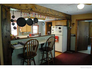 Kitchen Dining. Breakfast bar is practical and bri