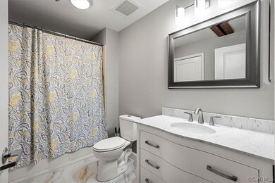 Full bathroom with vanity, shower / bathtub combin
