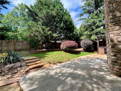Fenced backyard with a patio