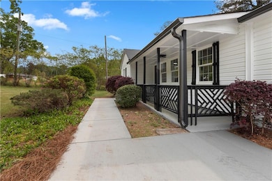 View of home's exterior with a porch