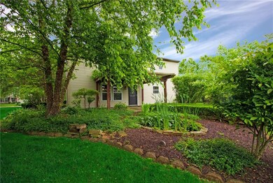 Lovely landscaping all around the nearly .5 acre lot!