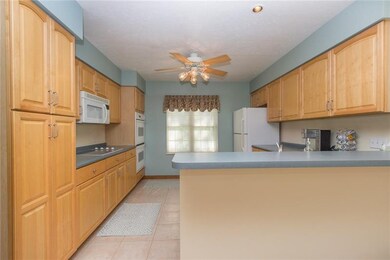 Clean sleek kitchen with pantry, double oven and a