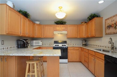 Lovely Kitchen with maple cabinets, granite counte