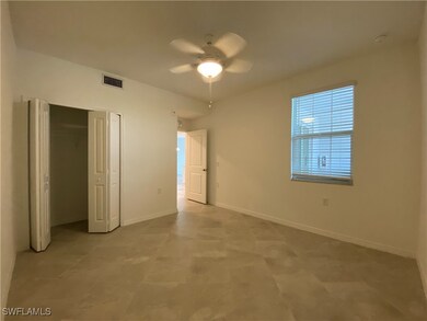 Unfurnished bedroom featuring ceiling fan and a cl