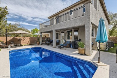 Large pool with synthetic turf and Covered patio/b