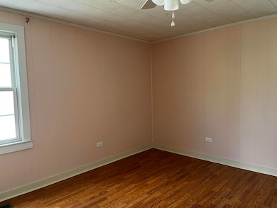 Spare room featuring dark wood-style floors, healt