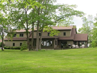 Waterside view of the home with...
