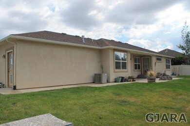 The landscaped yards are on a sprinkler system for