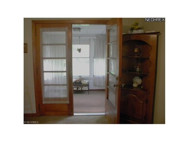 Enclosed porch off dining area.