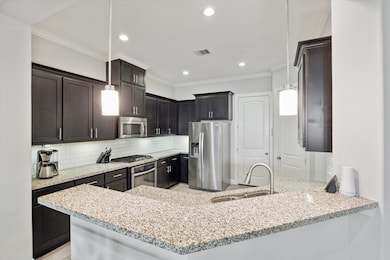 Opposite view of kitchen showing even more cabinet