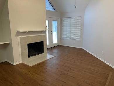 Unfurnished living room with dark wood-style floor