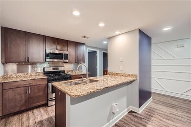 Kitchen featuring stainless steel appliances, sink