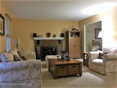 Living Room with wood burning fireplace.