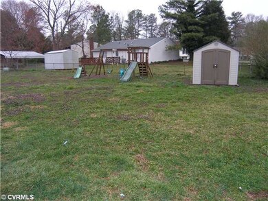 Exterior Back - Swingset & Storage Shed convey wit