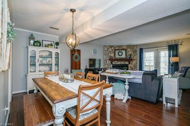 open plan living and dining areas. French doors lead to back deck