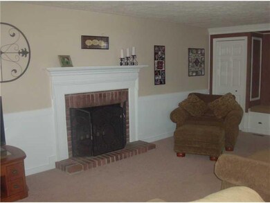Family Room. Firplace  with window seat and closet