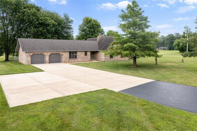 Large oversized garage with plenty of parking
