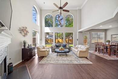 The living room overlooking the spacious back yard. Excellent flow with this open floor plan and continuous LVP flooring