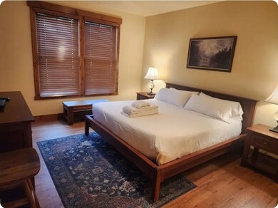 Bedroom with wood finished floors