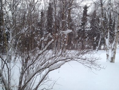 Private treed lot w/partial inlet views