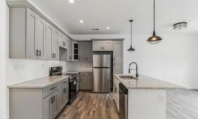 Kitchen featuring a sink, appliances with stainles