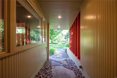 Flagstone pathway and covered entry.