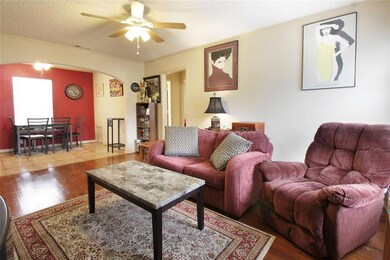 LIVING ROOM FROM ENTRY OPEN TO DINING ROOM WITH OW